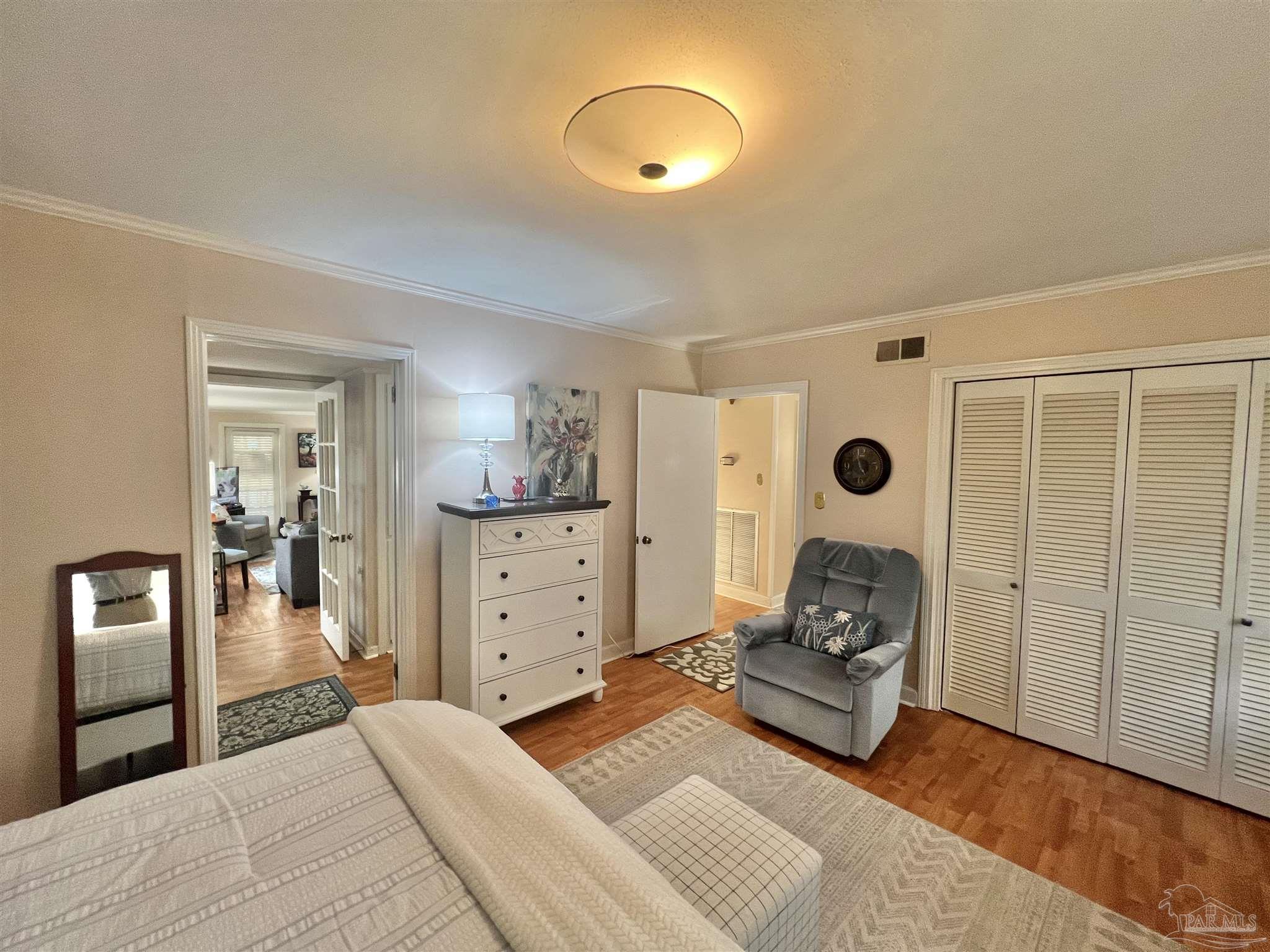 205 Highland Avenue Atmore, AL 36502 - Photo 25 of 43 a bedroom with a bed and a window