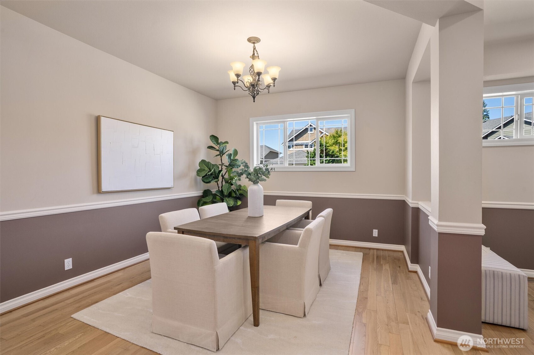 5503 Northeast 2nd Court Renton, WA 98059 - Photo 11 of 39 a dining room with chandelier and wooden floor