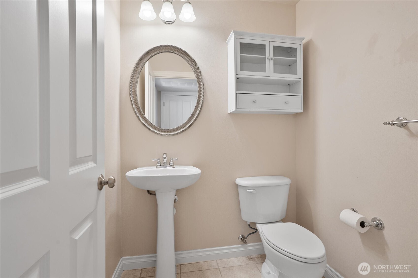 5503 Northeast 2nd Court Renton, WA 98059 - Photo 13 of 39 a bathroom with a toilet a sink and a mirror