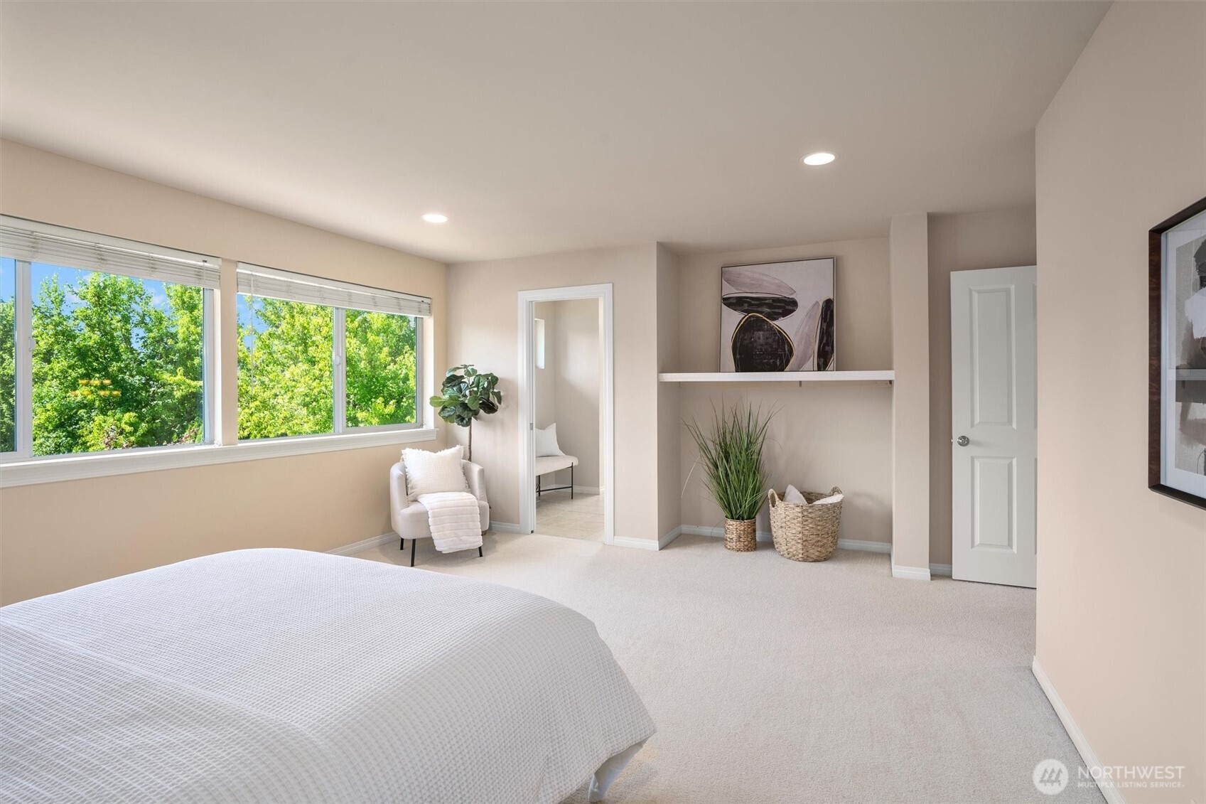 5503 Northeast 2nd Court Renton, WA 98059 - Photo 19 of 39 a bedroom with a large bed and a large window