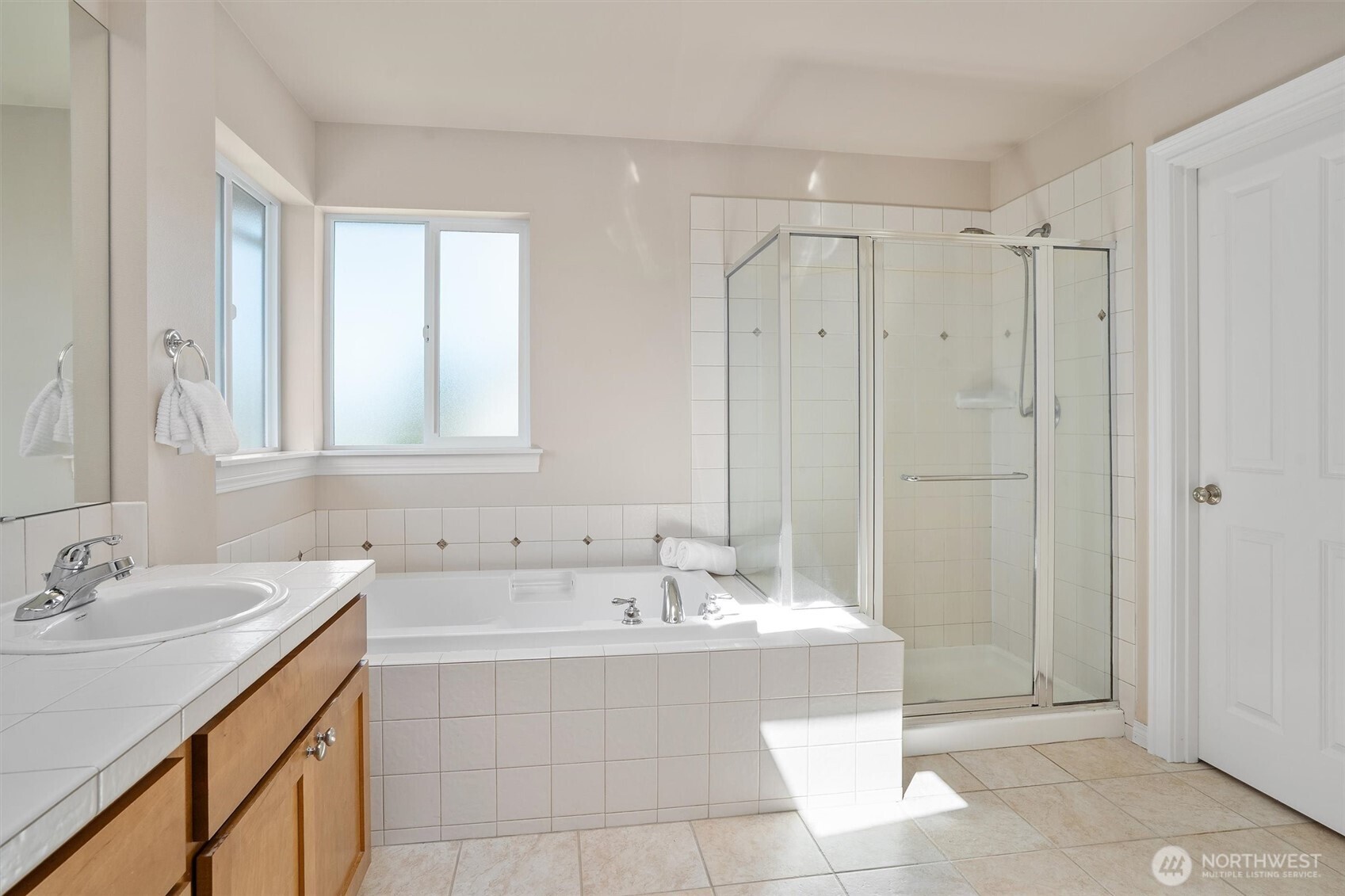 5503 Northeast 2nd Court Renton, WA 98059 - Photo 22 of 39 a bathroom with a tub sink shower and mirror