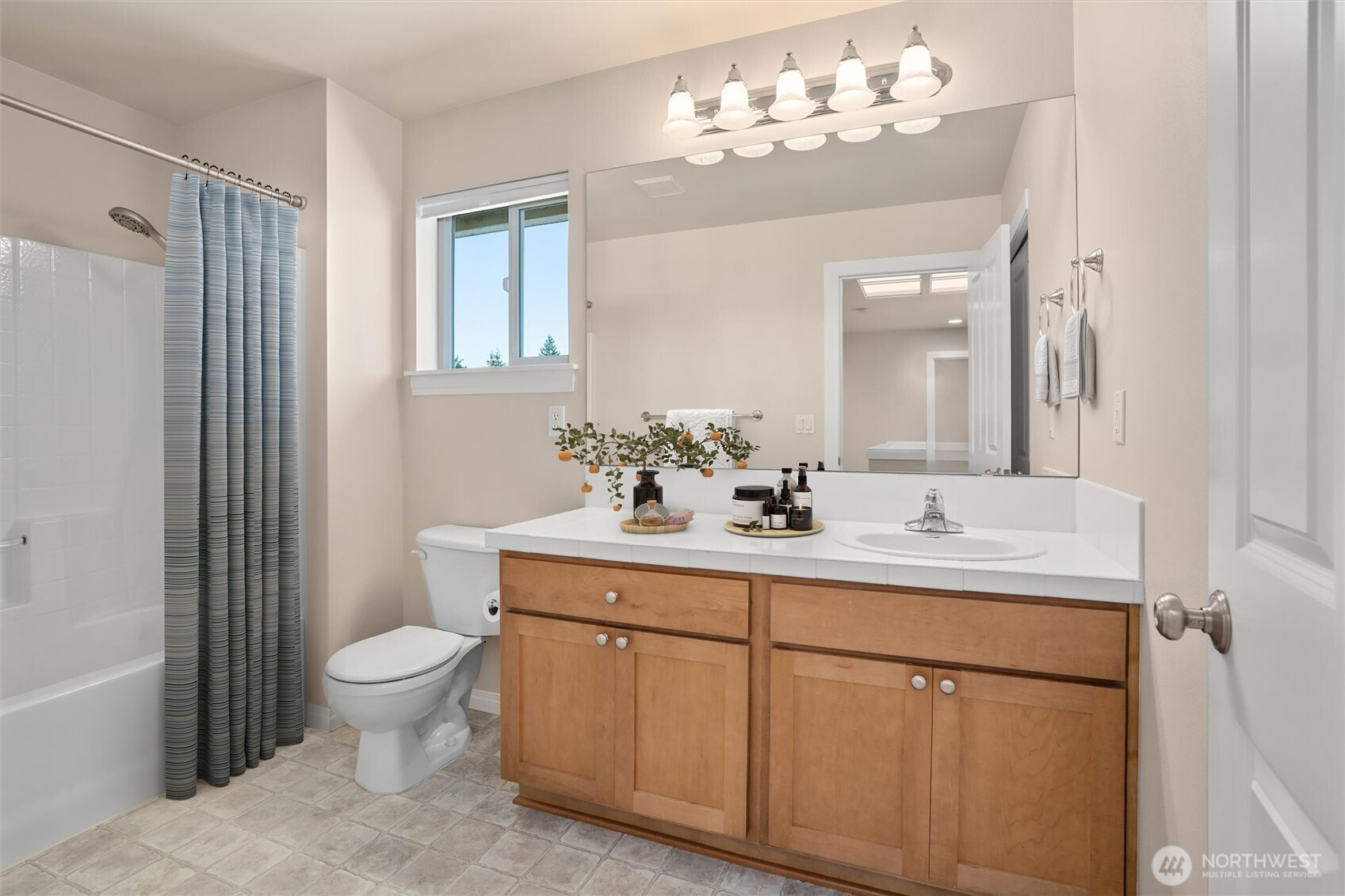 5503 Northeast 2nd Court Renton, WA 98059 - Photo 26 of 39 a bathroom with a sink toilet and shower