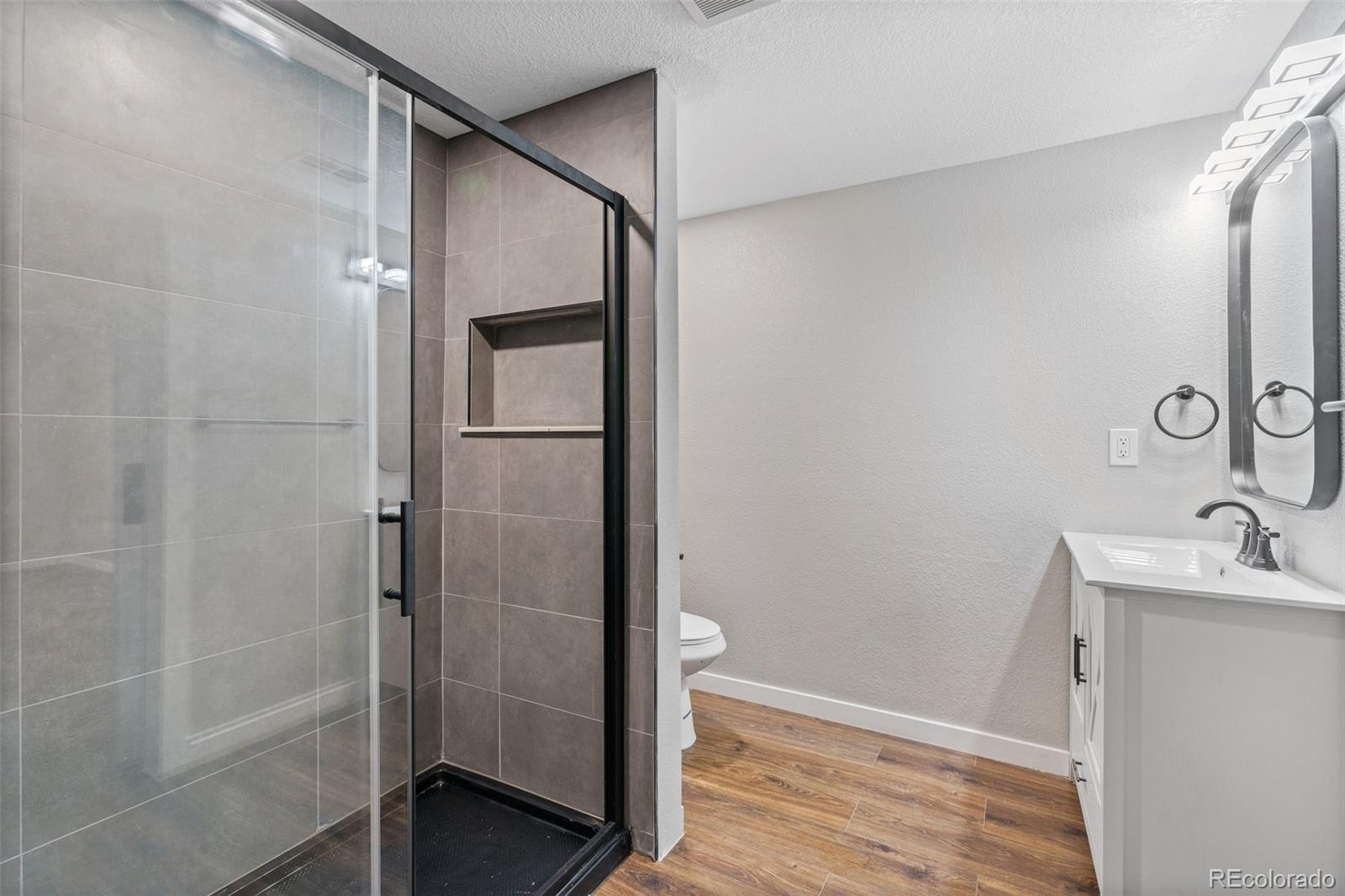 1853 South Decatur Street Denver, CO 80219 - Photo 16 of 22 a bathroom with a sink and shower