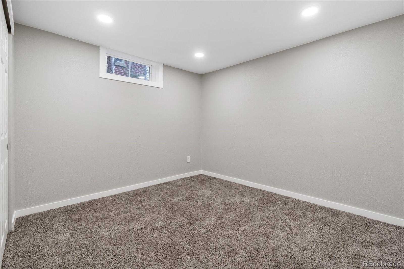1853 South Decatur Street Denver, CO 80219 - Photo 19 of 22 an empty room with a workbench