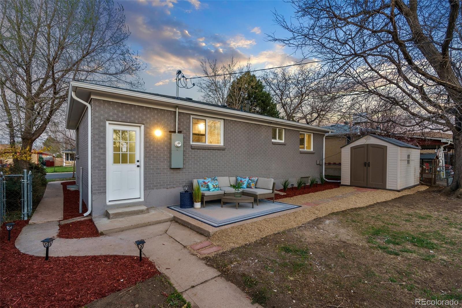 1853 South Decatur Street Denver, CO 80219 - Photo 21 of 22 a view of a house with backyard and sitting area