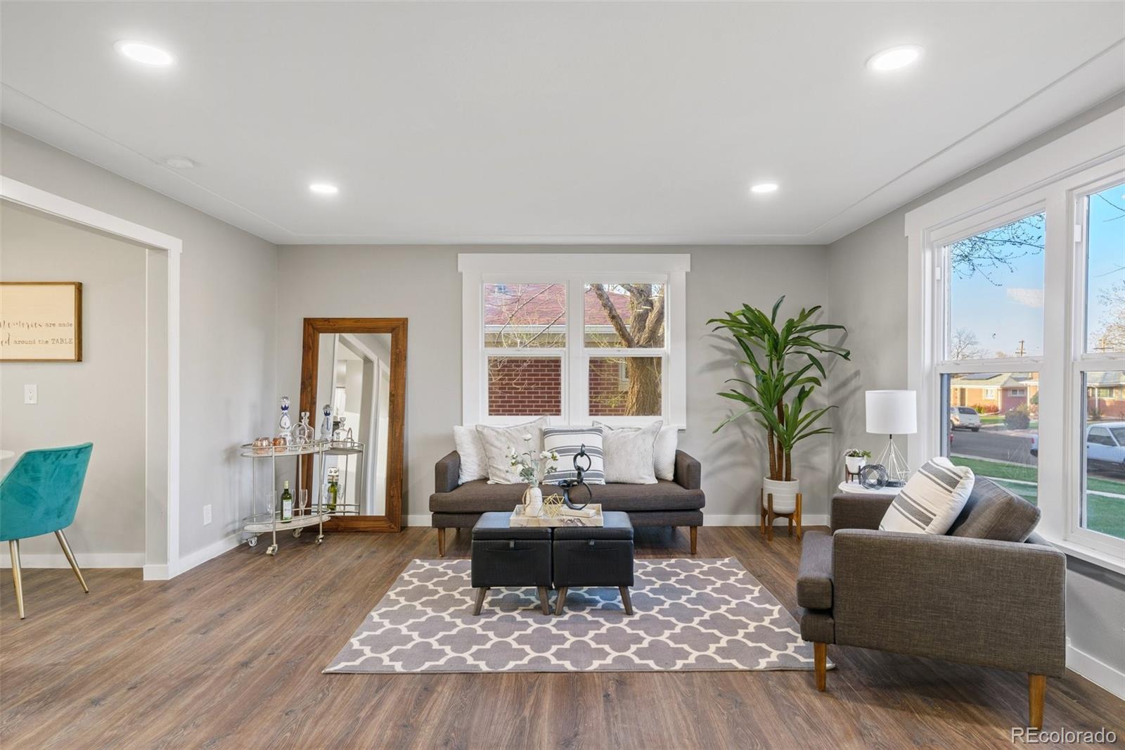 1853 South Decatur Street Denver, CO 80219 - Photo 3 of 22 a living room with furniture and a large window
