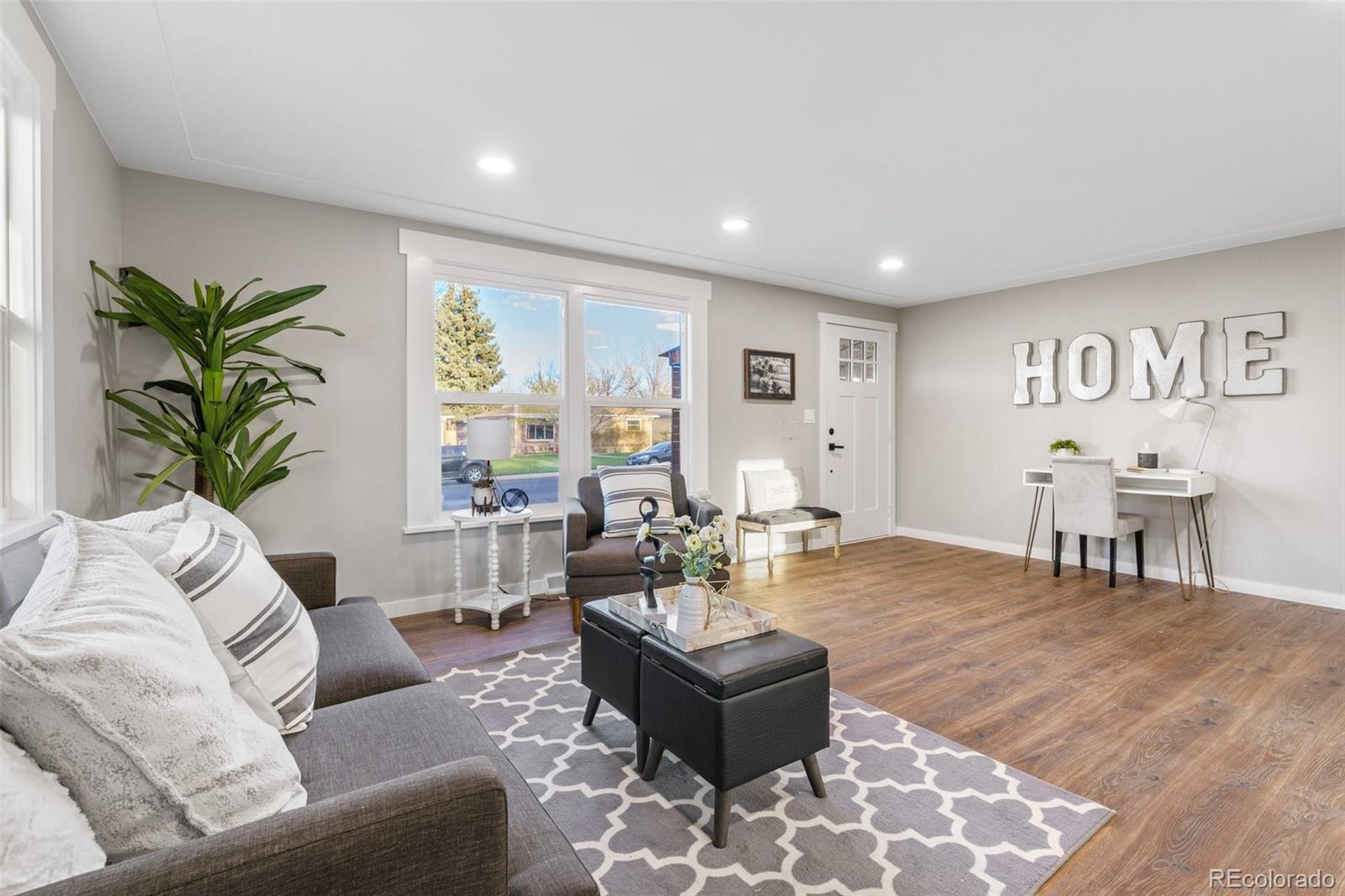 1853 South Decatur Street Denver, CO 80219 - Photo 4 of 22 a living room with furniture and a large window