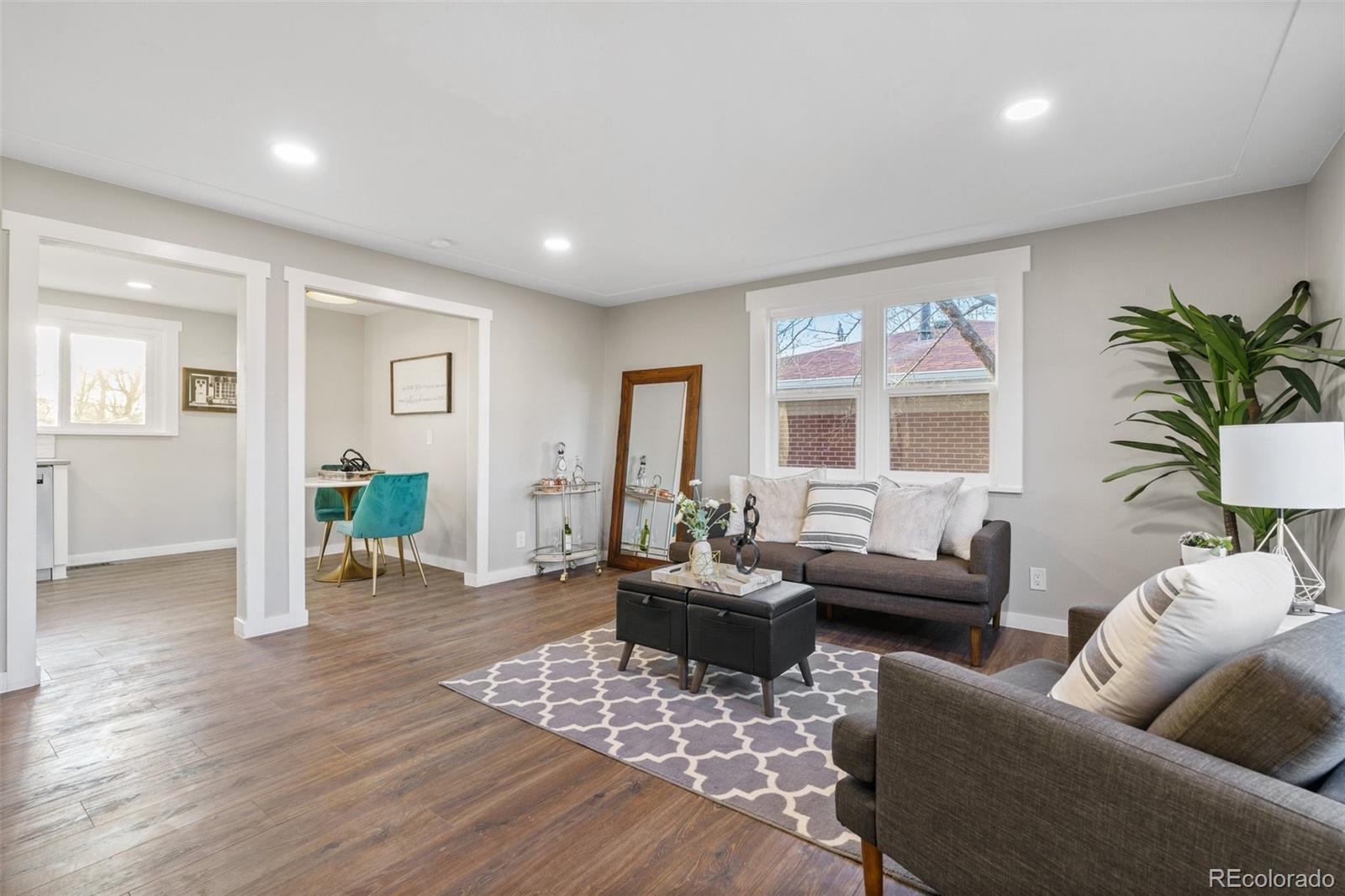 1853 South Decatur Street Denver, CO 80219 - Photo 5 of 22 a living room with furniture a window and wooden floor