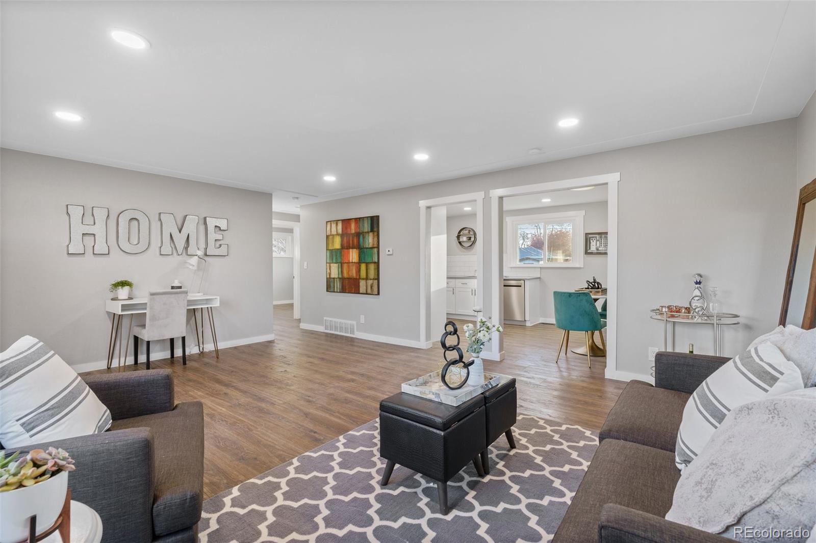 1853 South Decatur Street Denver, CO 80219 - Photo 6 of 22 a living room with furniture and wooden floor