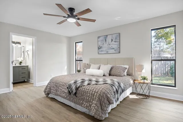 a bedroom with a large bed and a window