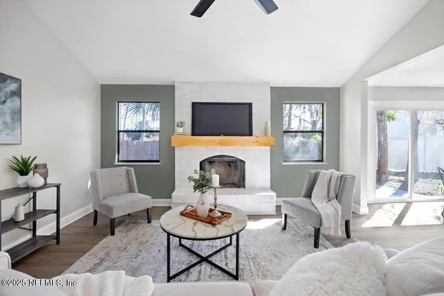 a living room with furniture and a fireplace