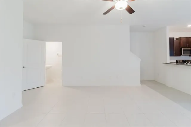 a view of a kitchen with a sink cabinets and a living room
