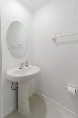 a kitchen with granite countertop a refrigerator and a stove top oven