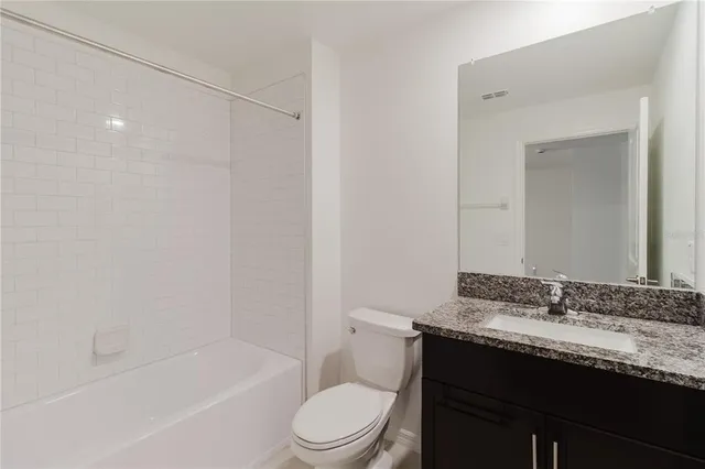 a view of a house with backyard and garden