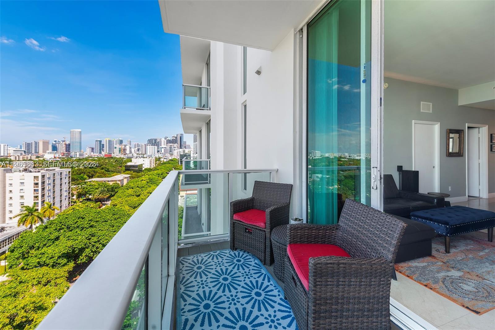 2525 Southwest 3rd Avenue, Unit 906 Miami, FL 33129 - Photo 16 of 23 a balcony with chairs and a table