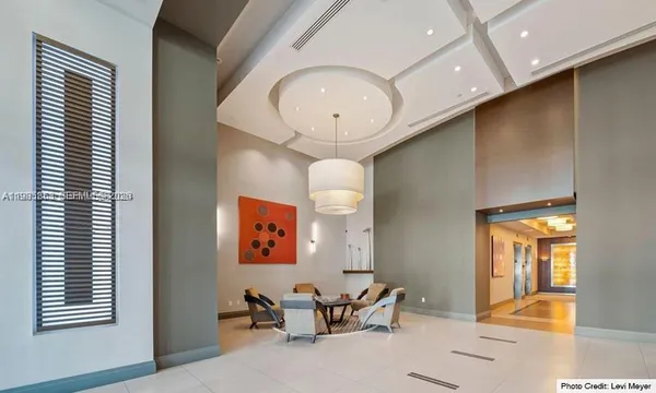 a view of a livingroom with furniture and windows