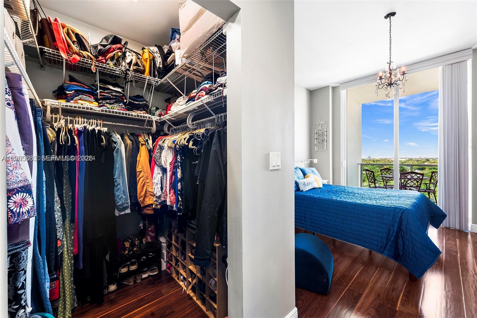 2525 Southwest 3rd Avenue, Unit 906 Miami, FL 33129 - Photo 9 of 23 a view of walk in closet with clothes and shoes