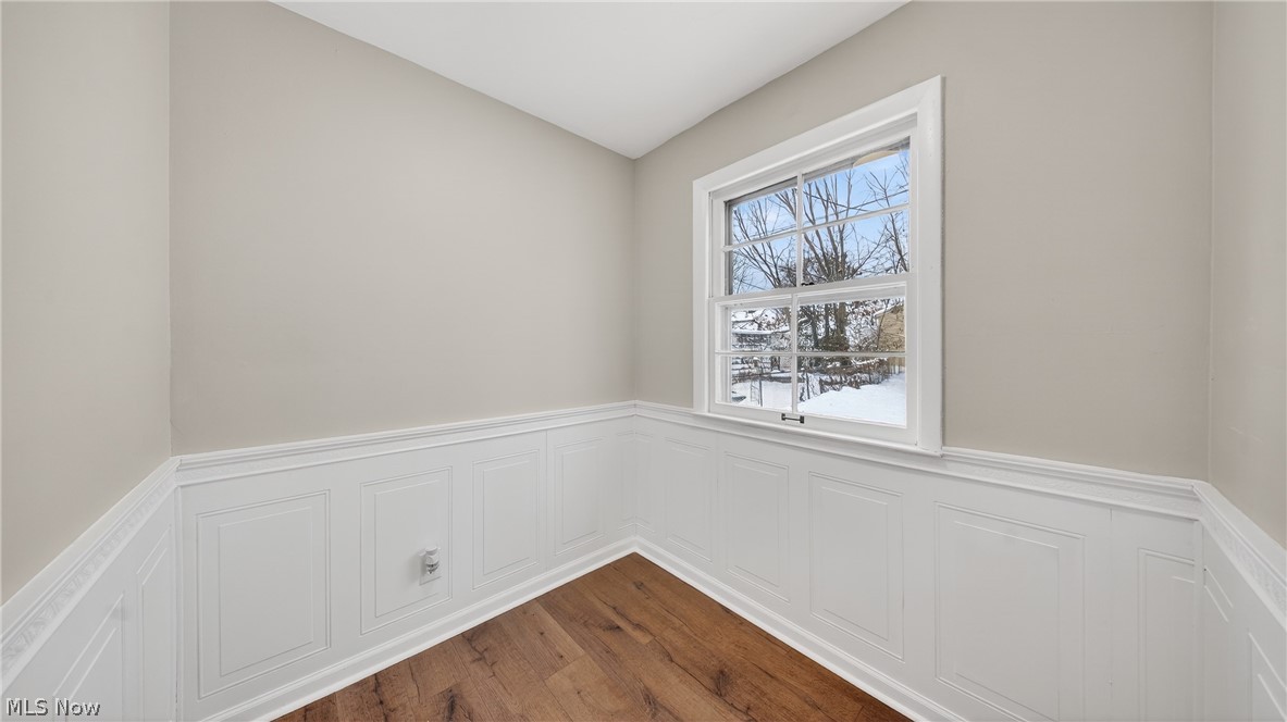 16811 Invermere Avenue Cleveland, OH 44128 - Photo 10 of 47 Eat in Kitchen with wainscoting, a decorative wall, dark wood-style flooring, and lofted ceiling