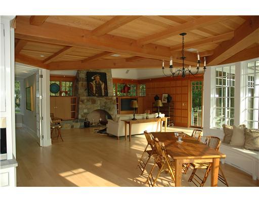 Undisclosed Address Darien, CT 06820 - Photo 13 of 20 a living room with furniture a flat screen tv and a floor to ceiling window
