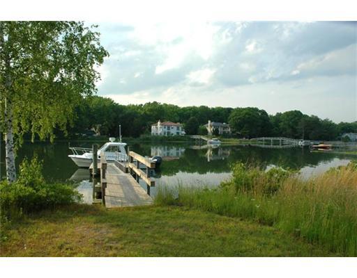 Undisclosed Address Darien, CT 06820 - Photo 5 of 20 a view of a lake with a big yard