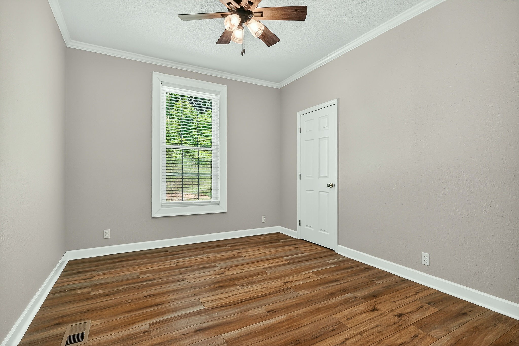 16062 Buffalo Valley Road Silver Point, TN 38582 - Photo 20 of 27 a view of empty room with wooden floor and fan