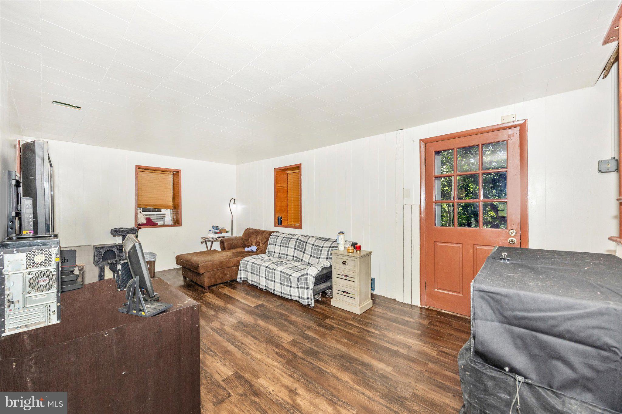 14721 Albert Staub Road Thurmont, MD 21788 - Photo 13 of 46 a living room with furniture and a window