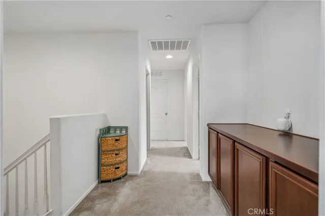 a view of a hallway to room with hallway