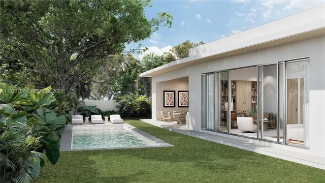 a view of a patio with a table and chairs next to a yard