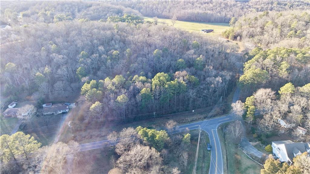 0 Peeples Valley Road Northeast Cartersville, GA 30121 - Photo 2 of 6 a vase of flowers sitting on a wooden floor