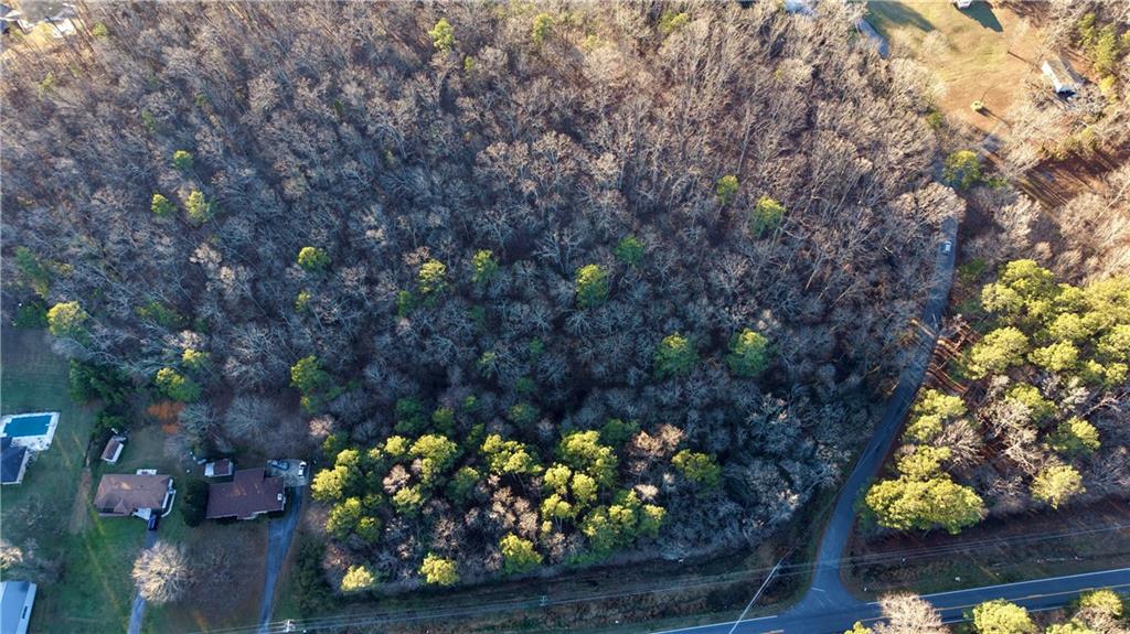 0 Peeples Valley Road Northeast Cartersville, GA 30121 - Photo 3 of 6 a view of a wooden bench with a tree