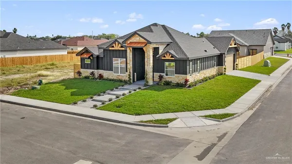 front view of a house with a yard