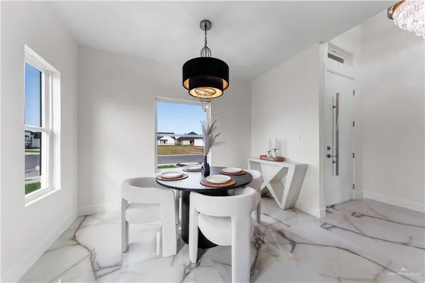a dining room with furniture and window