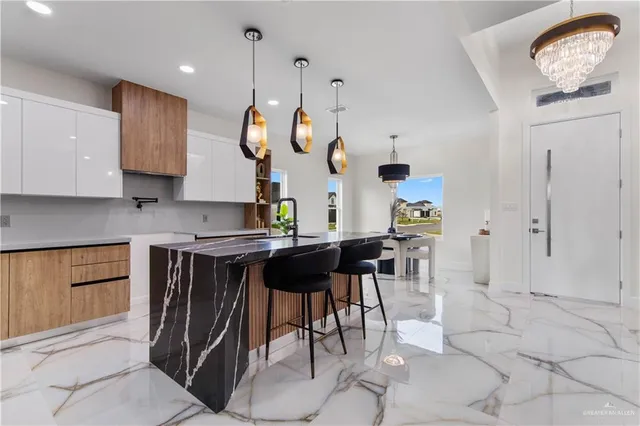 a kitchen with a table and chairs in it