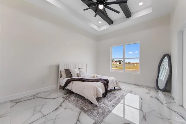 a bedroom with a bed window and chair