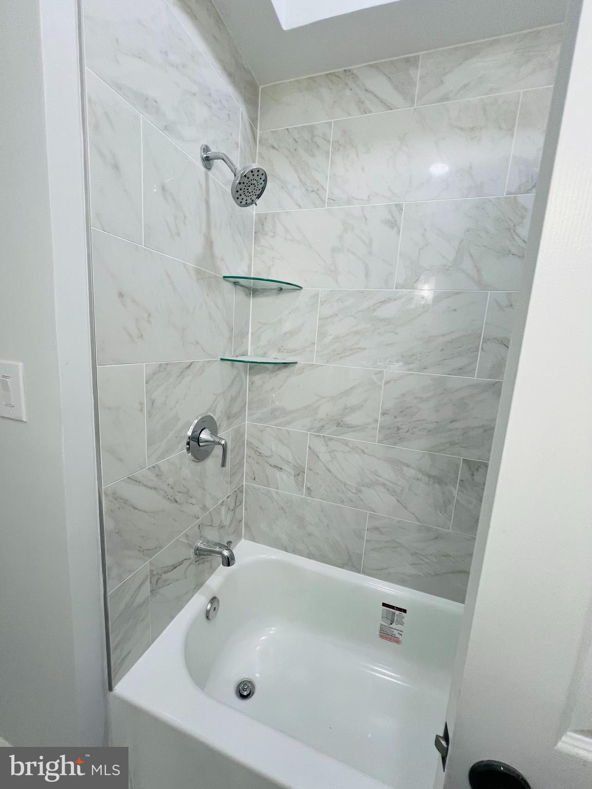 223 Maypole Road Upper Darby, PA 19082 - Photo 15 of 48 a bathroom with a bathtub