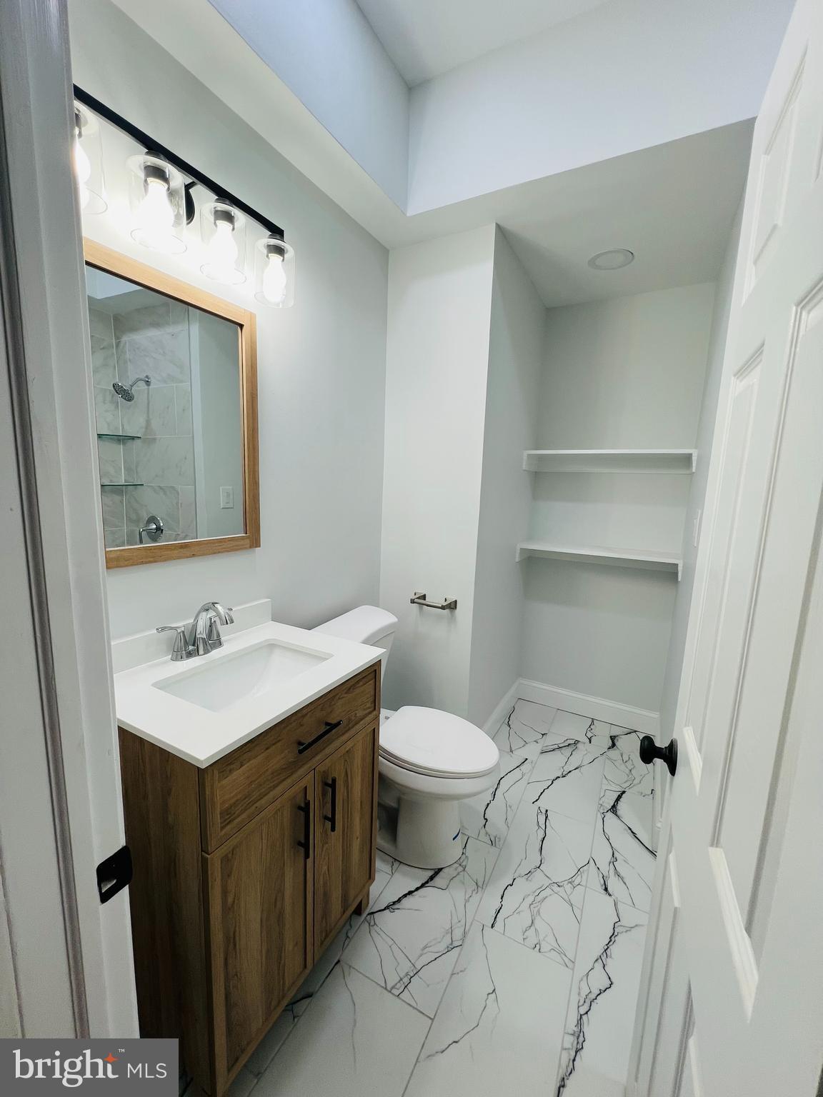 223 Maypole Road Upper Darby, PA 19082 - Photo 16 of 48 a bathroom with a sink and a toilet