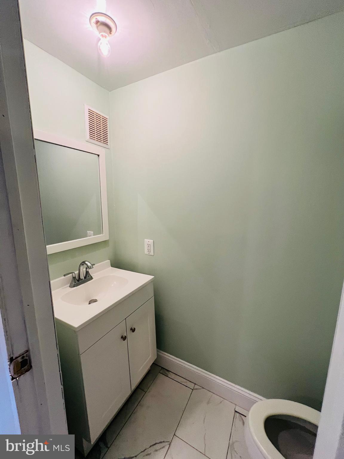 223 Maypole Road Upper Darby, PA 19082 - Photo 32 of 48 a bathroom with a sink and a mirror