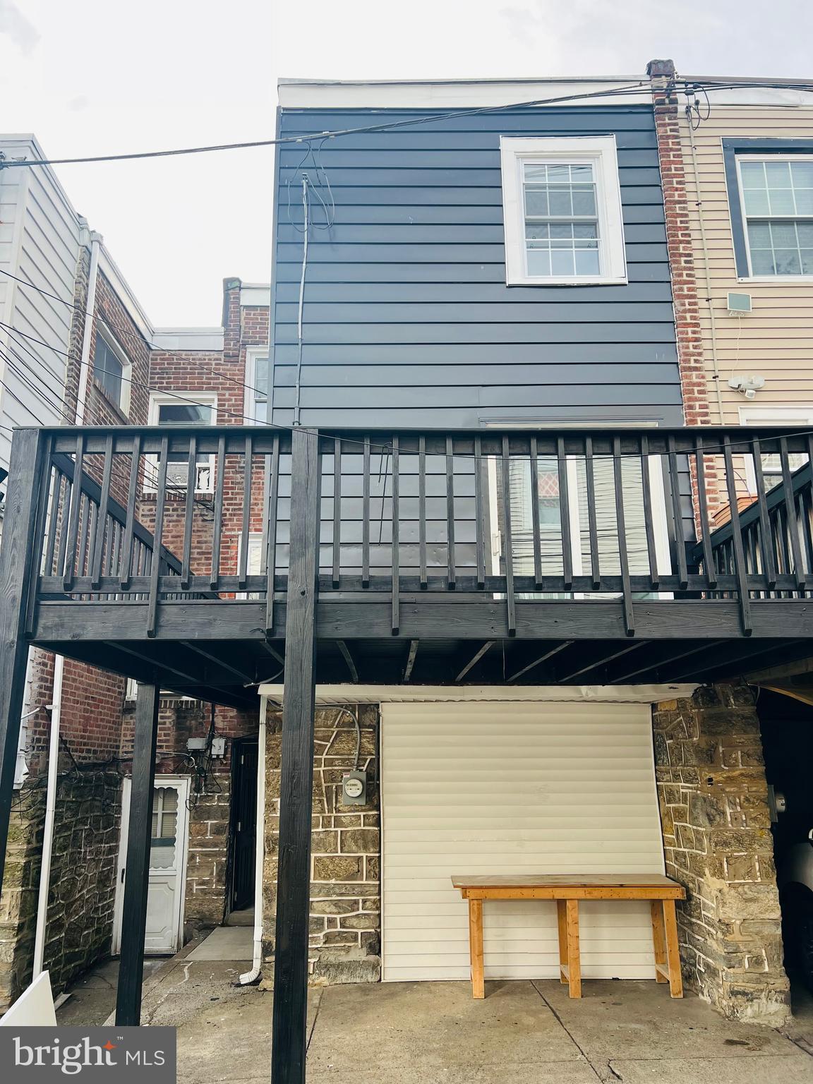 223 Maypole Road Upper Darby, PA 19082 - Photo 42 of 48 a view of a balcony with wooden floor and fence