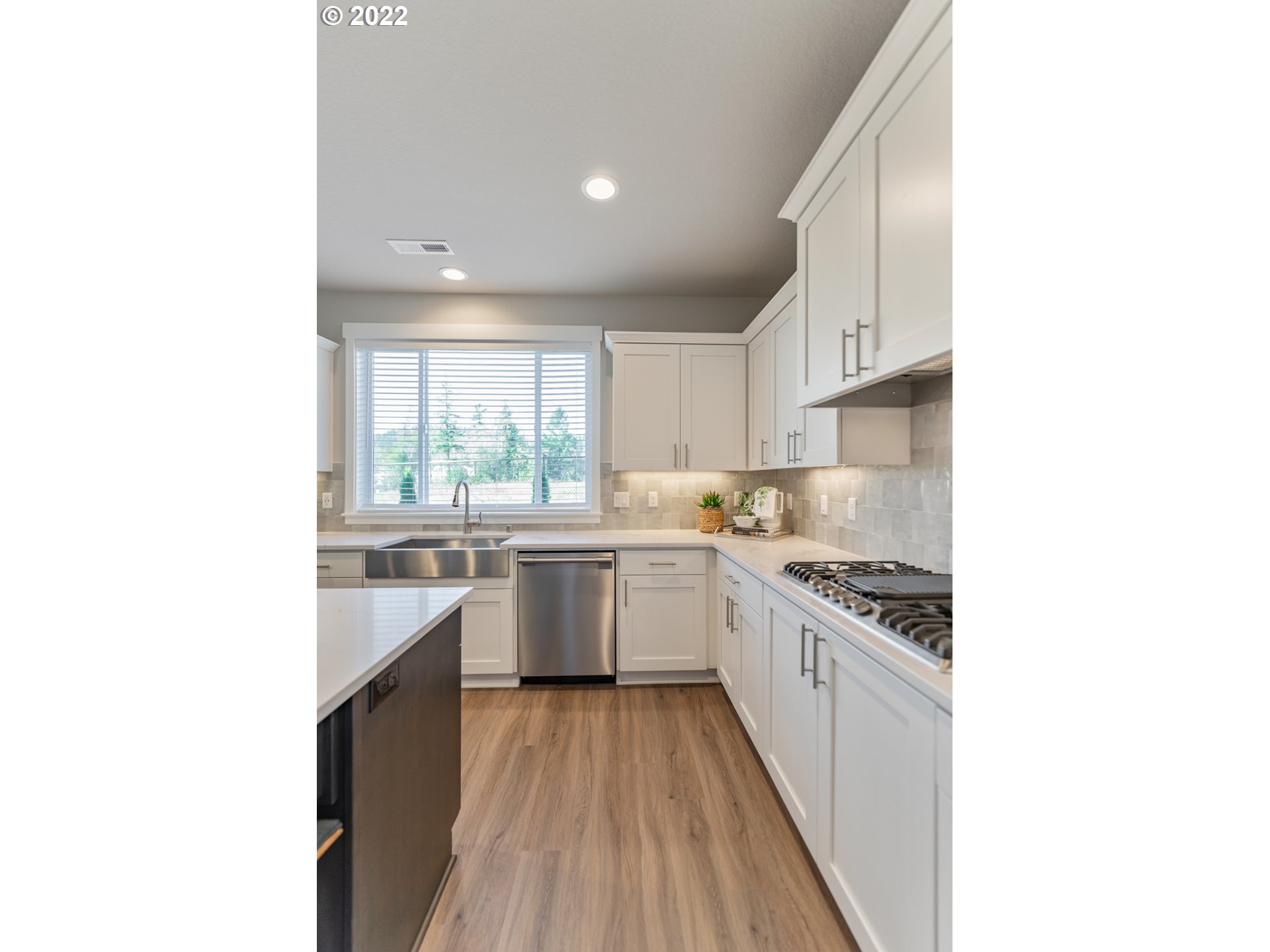 5657 North 92nd Avenue Camas, WA 98607 - Photo 15 of 32 a kitchen with a sink and cabinets