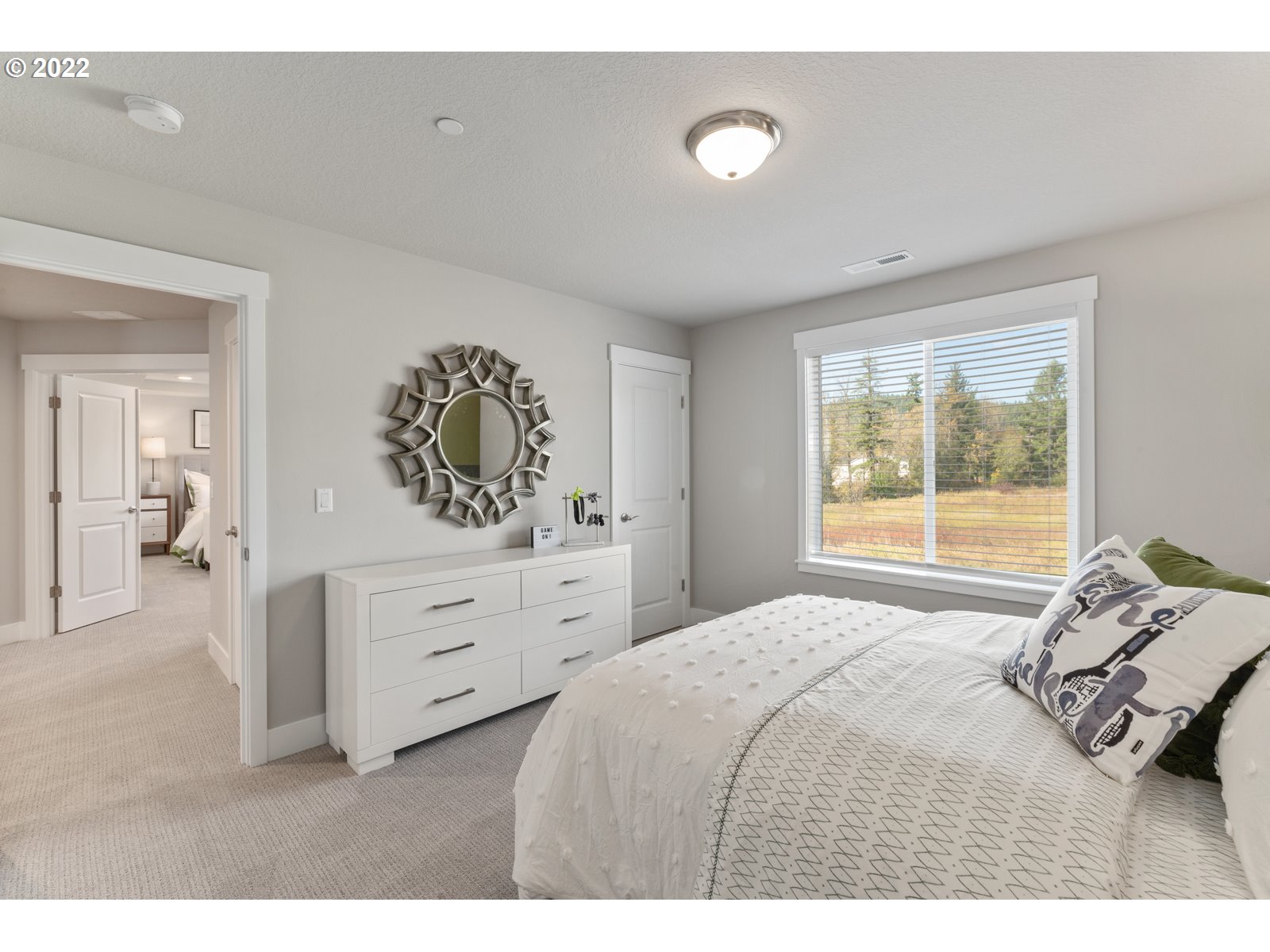 5657 North 92nd Avenue Camas, WA 98607 - Photo 21 of 32 a bedroom with a bed and a window