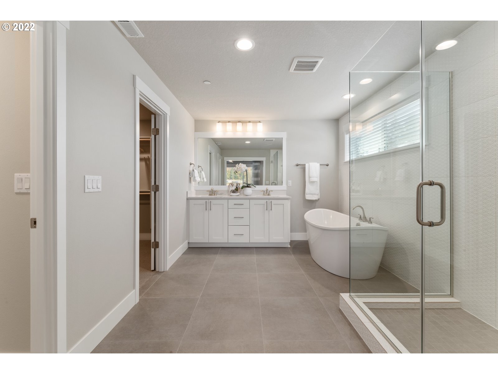 5657 North 92nd Avenue Camas, WA 98607 - Photo 27 of 32 a open kitchen with white cabinets and wooden floor