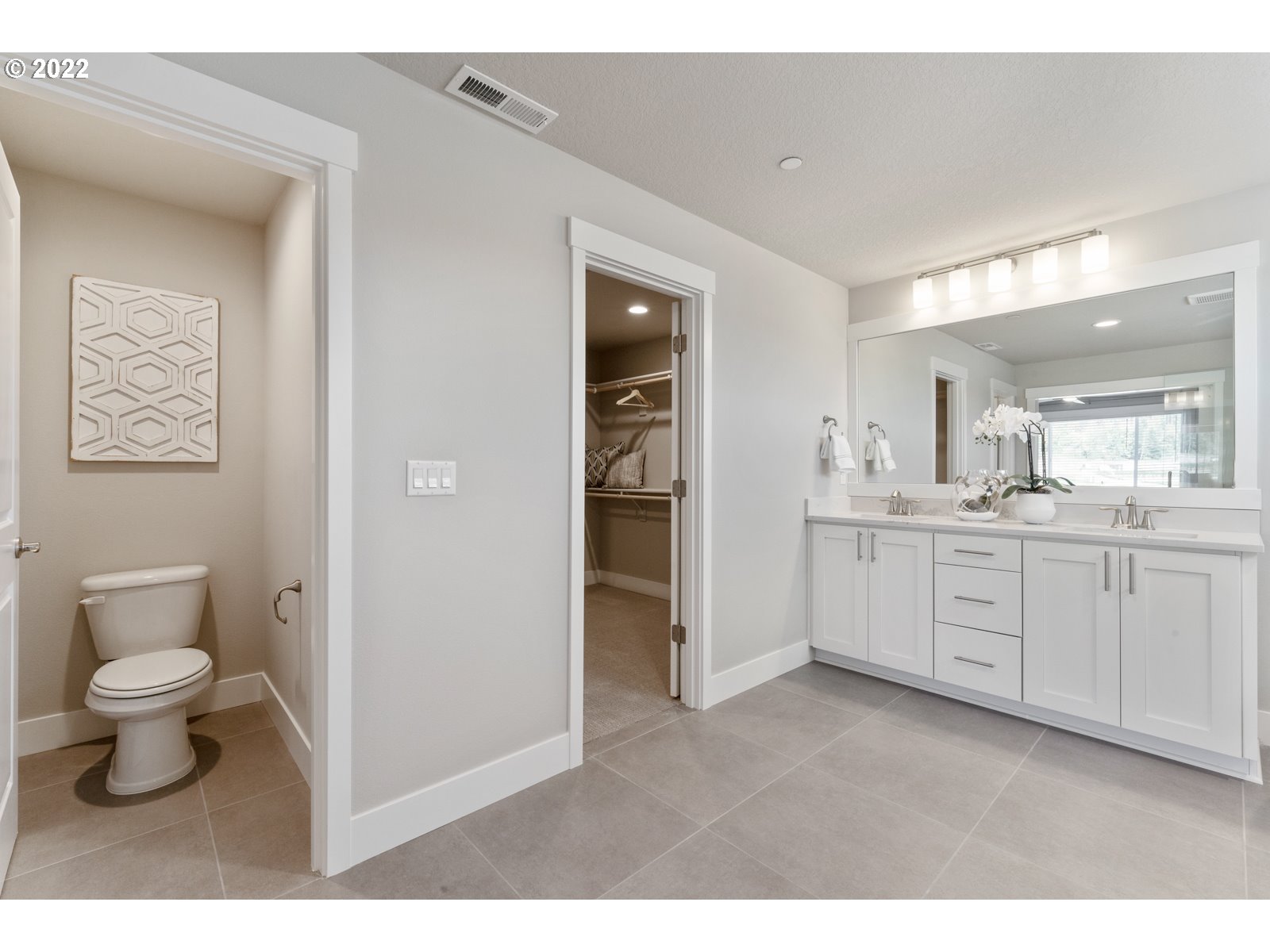 5657 North 92nd Avenue Camas, WA 98607 - Photo 29 of 32 a bathroom with a toilet sink and a vanity