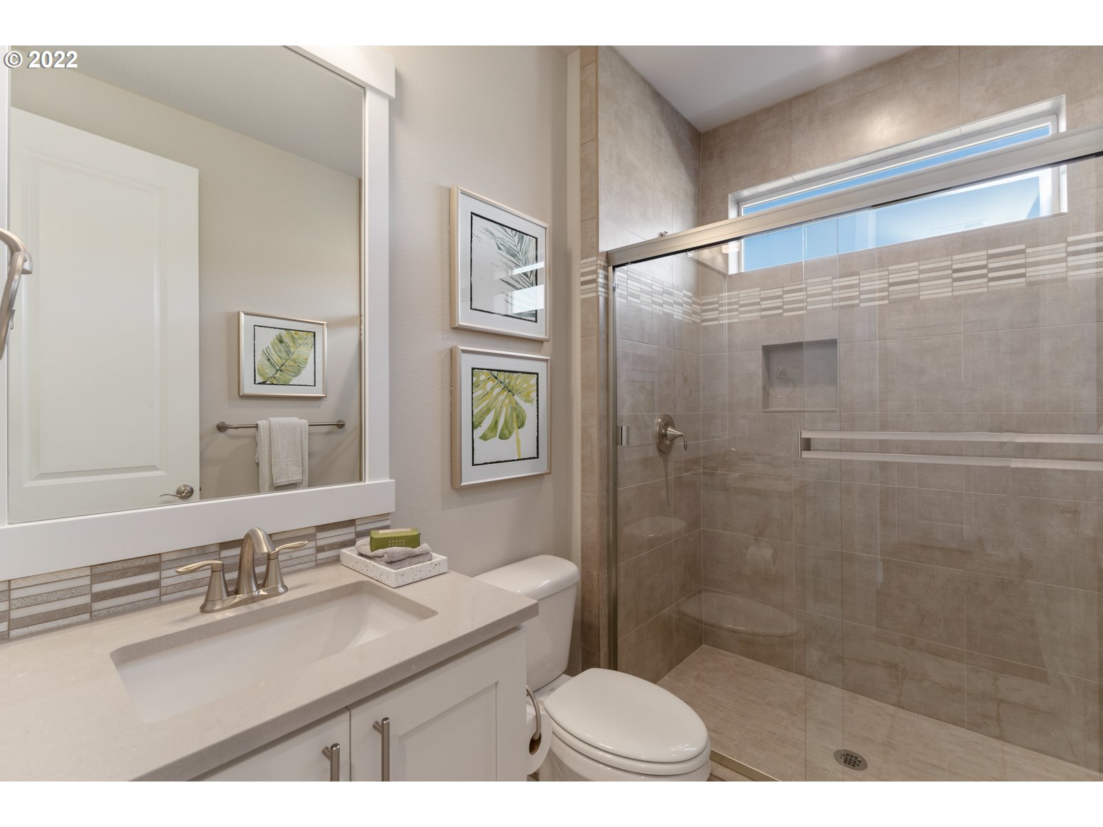 5657 North 92nd Avenue Camas, WA 98607 - Photo 3 of 32 a bathroom with a sink a toilet a mirror and shower