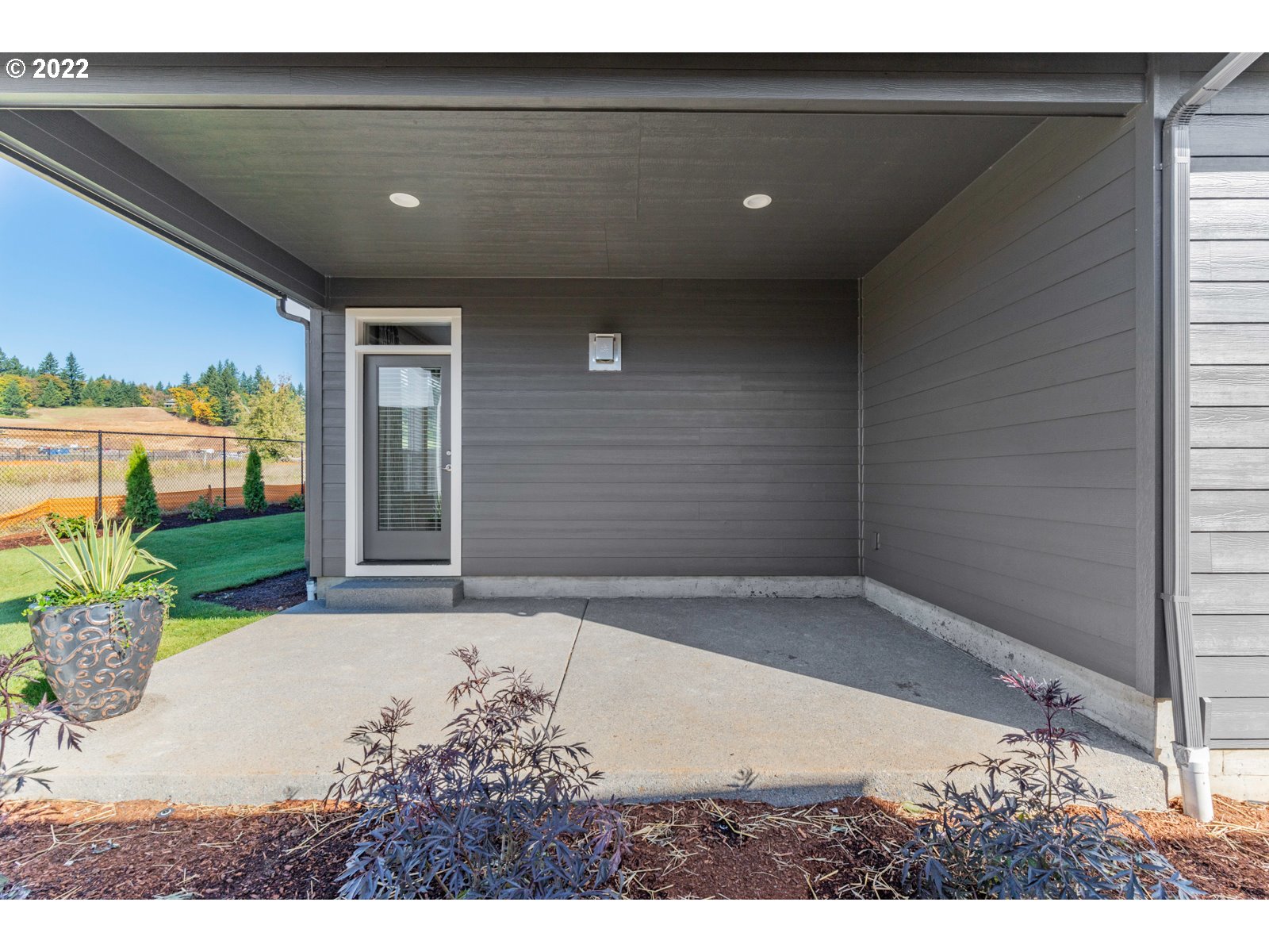 5657 North 92nd Avenue Camas, WA 98607 - Photo 31 of 32 a view of house with backyard and glass door