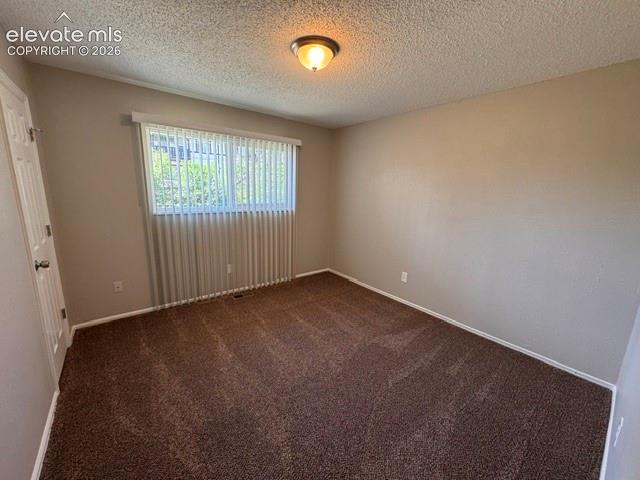 1922 Monterey Road Colorado Springs, CO 80910 - Photo 10 of 21 an empty room with a window