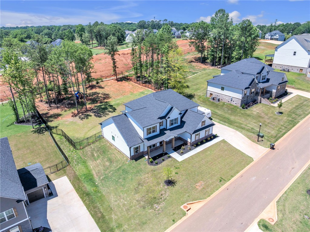 226 Holly Br Road Piedmont, SC 29673 - Photo 38 of 44 A newly constructed residence boasts an inviting front porch and a generous, well-maintained lawn.