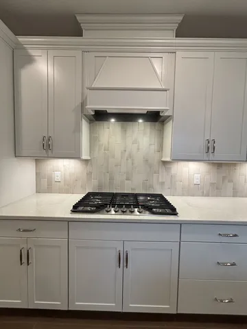 a living room filled with furniture and painting on the wall