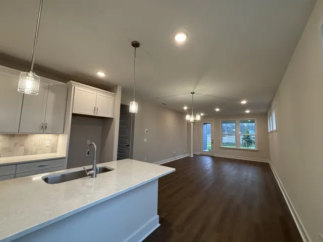 a view of a dining table and chairs in patio