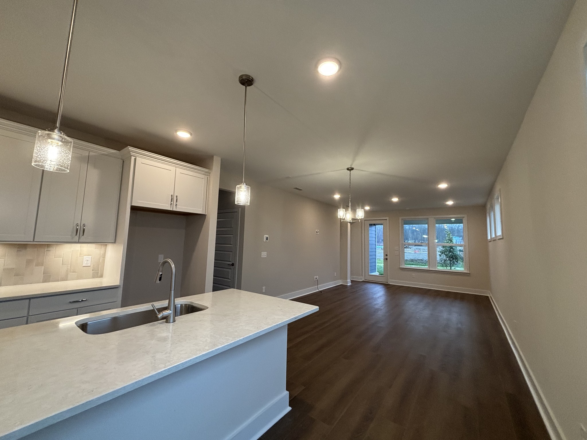 537 Scarlet Oak Road Lebanon, TN 37090 - Photo 17 of 38 a kitchen with kitchen island a sink appliances and a counter top space