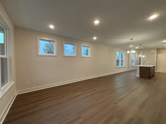 an aerial view of residential houses with outdoor space and street view